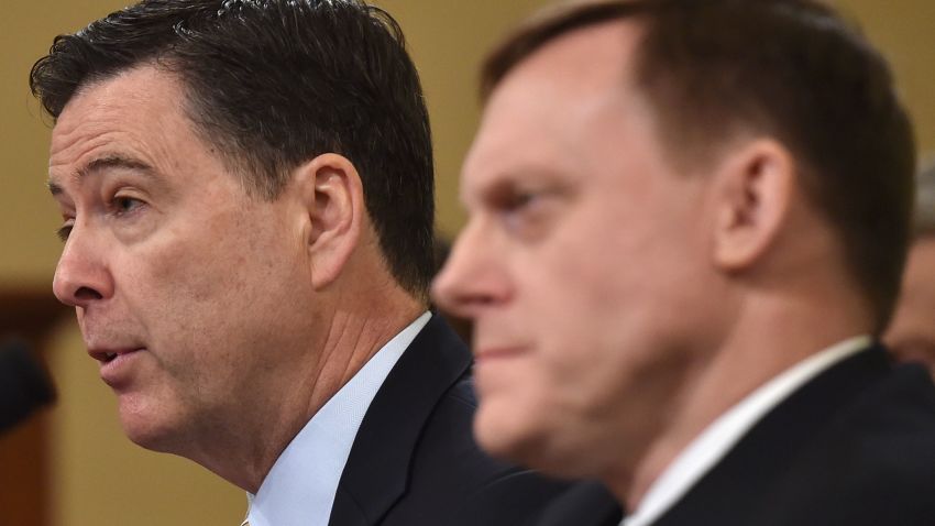 FBI Director James Comey (L) speaks as National Security Agency Director Mike Rogers looks on during the House Permanent Select Committee on Intelligence hearing on Russian actions during the 2016 election campaign on March 20, 2017 on Capitol Hill in Washington, DC. 

       / AFP PHOTO / Nicholas Kamm        (Photo credit should read NICHOLAS KAMM/AFP/Getty Images)