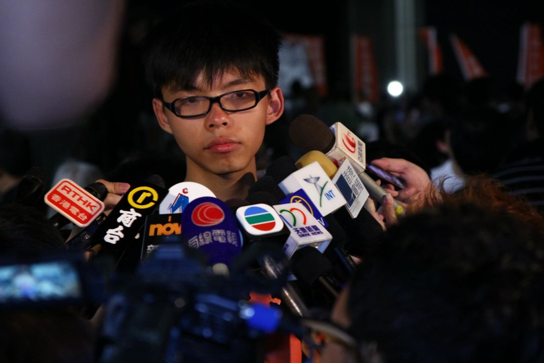 A 15-year-old Joshua Wong talks to the press at a Scholarism rally in July 2012.