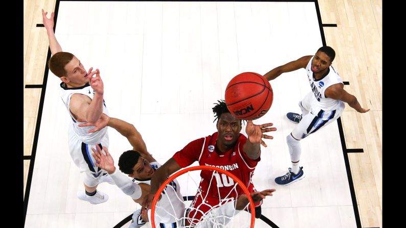 Wisconsin forward Nigel Hayes takes a shot against Villanova during an NCAA Tournament game on Saturday, March 18. Hayes later scored <a href="index.php?page=&url=http%3A%2F%2Fbleacherreport.com%2Farticles%2F2698760-nigel-hayes-tosses-game-winning-layup-vs-villanova" target="_blank" target="_blank">the game-winning basket</a> to upset the defending champions and advance to the Sweet Sixteen. Villanova was a No. 1 seed; Wisconsin was an 8. 