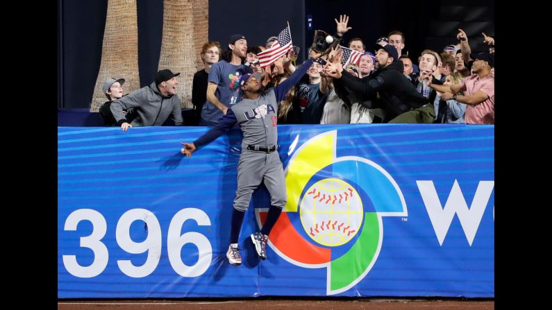 US outfielder Adam Jones steals a home run during a second-round game at the World Baseball Classic on Saturday, March 18. Manny Machado, the Dominican player who hit the ball, <a href="index.php?page=&url=http%3A%2F%2Fbleacherreport.com%2Farticles%2F2698807-adam-jones-robs-manny-machado-of-home-run-at-world-baseball-classic" target="_blank" target="_blank">tipped his cap to Jones,</a> his teammate with the Baltimore Orioles. The Americans advanced to the semifinals with a 6-3 victory.