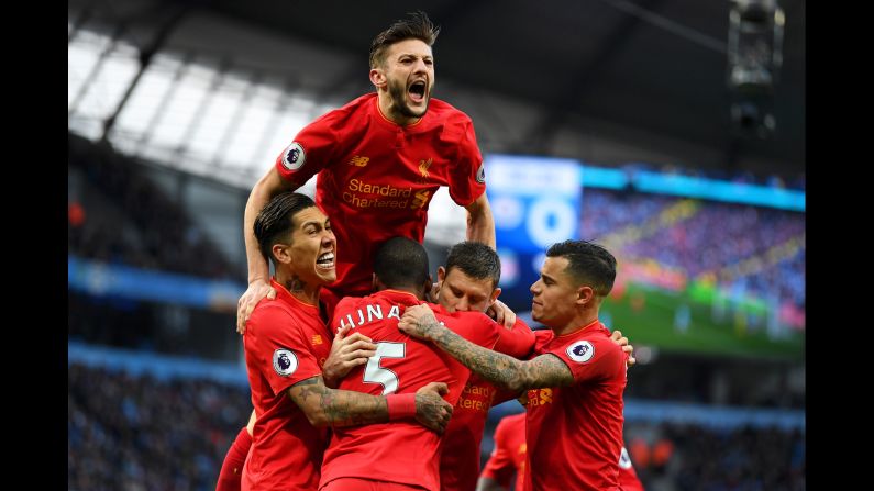 Liverpool players celebrate after James Milner's goal against Manchester City on Sunday, March 19. The Premier League match ended 1-1 in Manchester, England.