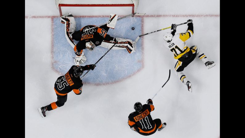 Pittsburgh's Evgeni Malkin, right, is denied by Philadelphia goalie Chris Mason during an NHL hockey game on Wednesday, March 15. Mason and the Flyers shut out their in-state rivals 4-0.