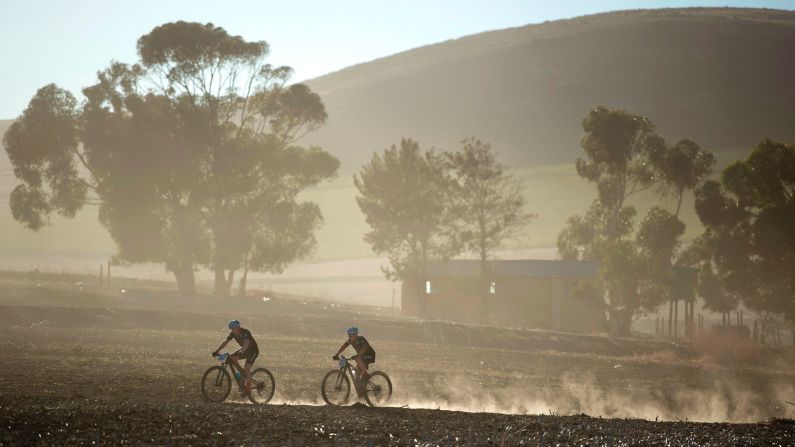 Cyclists ride through wheat fields in Grabouw, South Africa, during the prologue stage of the Cape Epic race on Sunday, March 19. <a href="index.php?page=&url=http%3A%2F%2Fwww.cnn.com%2F2017%2F03%2F14%2Fsport%2Fgallery%2Fwhat-a-shot-sports-0314%2Findex.html" target="_blank">See 25 amazing sports photos from last week</a>