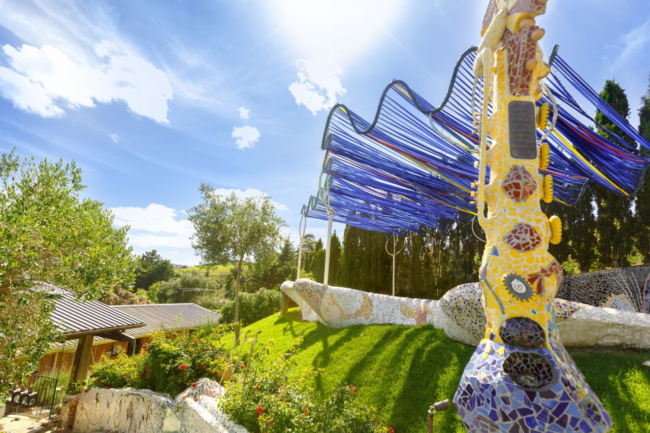 <strong>Casita Miro:</strong> For diners who choose to climb to the Gaudi-esque mosaic garden above, the reward is a view over the vines and out to sea.