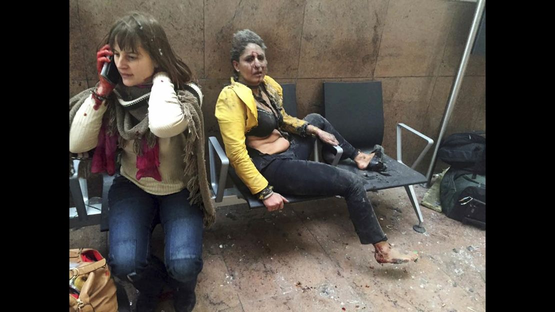In this file photo, Nidhi Chaphekar, right, and another unidentified woman are shown after being wounded following explosions at Brussels Airport in Belgium in March 2016.