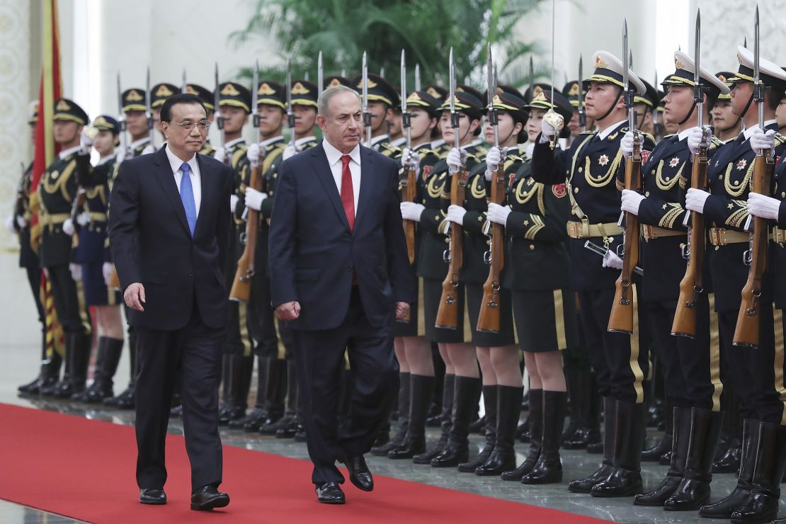 Chinese Premier Li Keqiang (left) accompanies Israeli Prime Minister Benjamin Netanyahu inside the Great Hall of the People in Beijing on March 20, 2017.