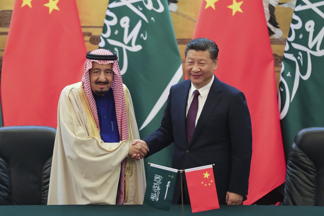 Chinese President Xi (R) shake hands with Saudi Arabia's King Salman in the Great Hall of the People on March 16, 2017 in Beijing.