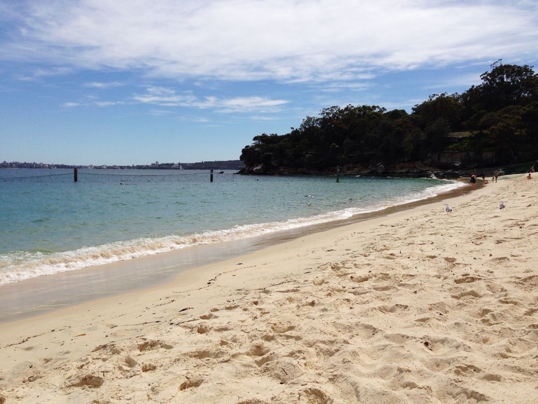 Adjoining a national park, the harbor beach feels secluded.