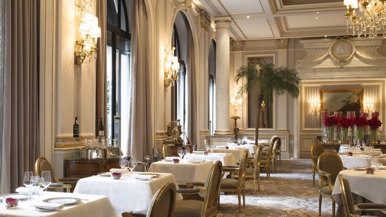 <strong>Le Cinq: </strong>Le Cinq's dining room, located in the Four Seasons Hotel George V,  is decorated in gold and gray and includes priceless furniture from the reign of French kings Louis XIV and XVI.
