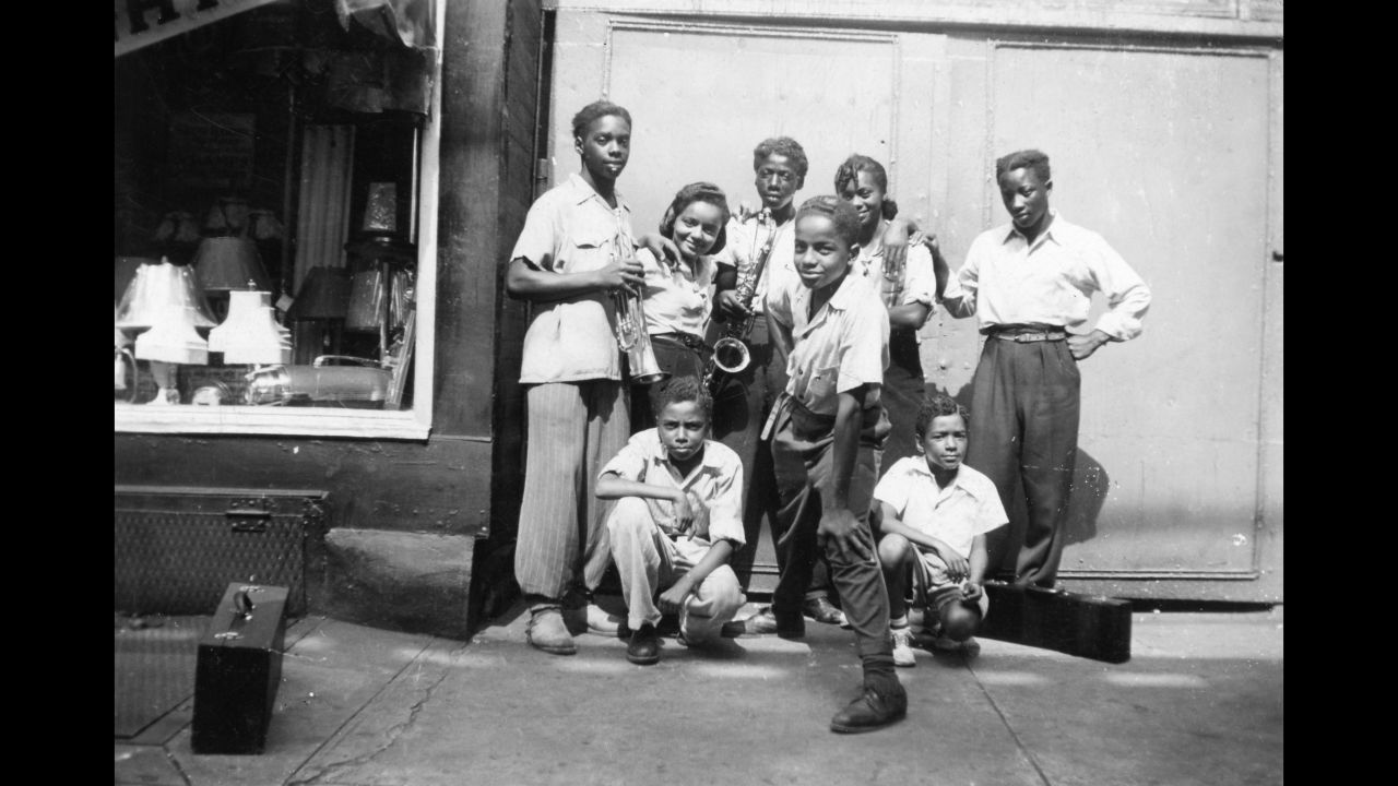 Some of Fitzpatrick's friends pose near a lamp shop. Evans had possession of his mother's scrapbook after her death, which happened 30 years ago on March 23. He said Smithsonian curators were amazed when they first saw her photos. "You can find photos like my mother's that are 70-80 years old, but typically people don't know who's in the photos, they don't know where the photos were from," Evans said. "But my mother really documented how African-Americans, for a 10-year period, adjusted to life in the North coming from the rural South. And it showed how communities were formed."