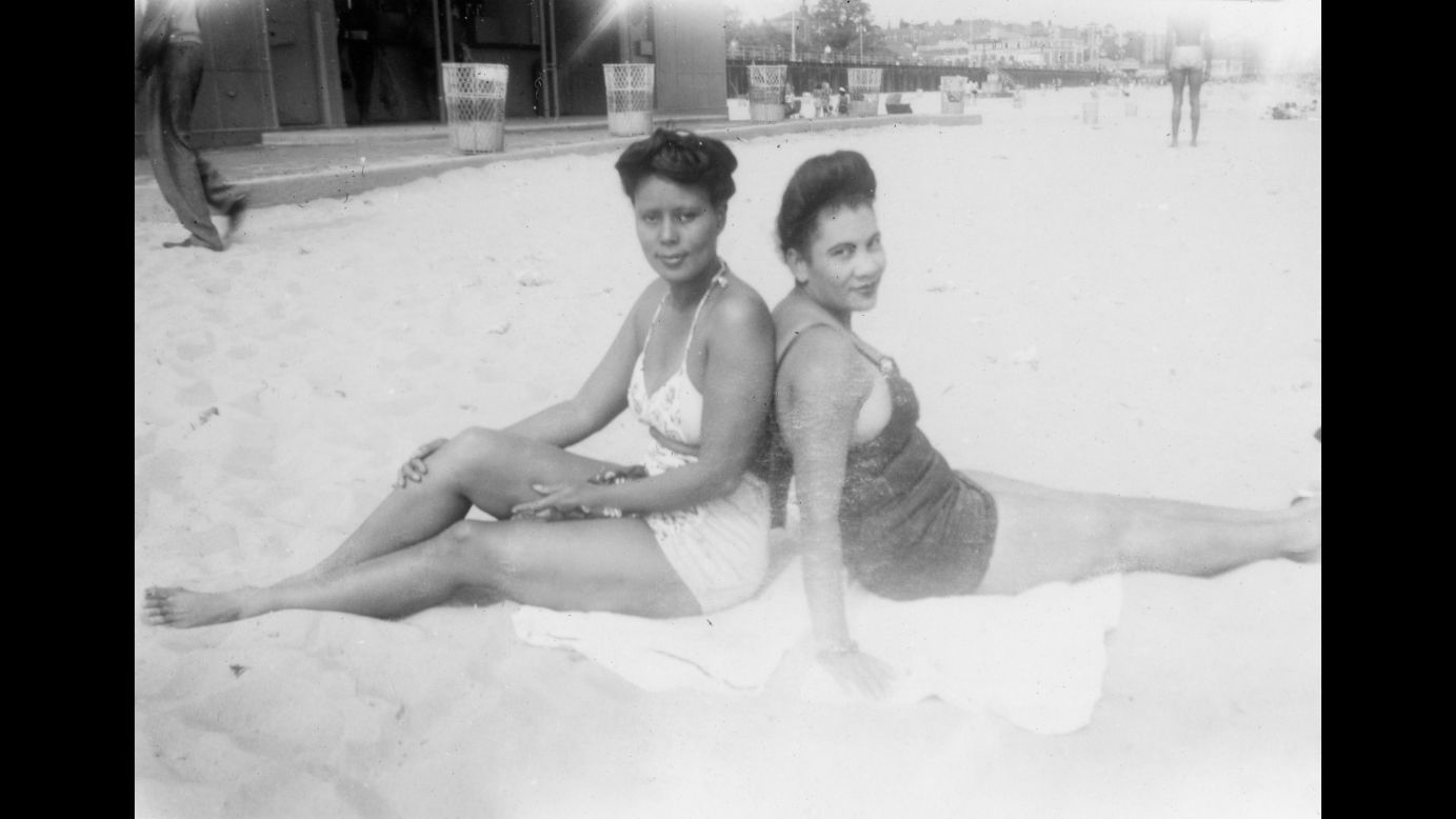 Women sit at the Coney Island beach in 1943.