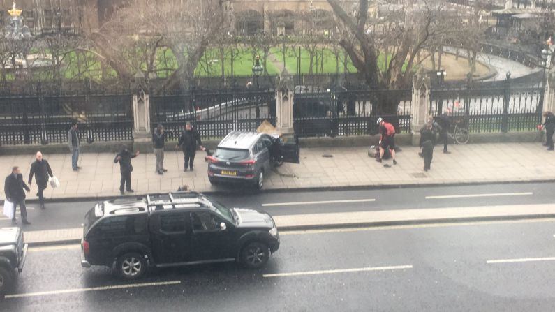 A car is seen crashed into a fence outside the Parliament building in London on Wednesday, March 22. Police have <a href="index.php?page=&url=http%3A%2F%2Fwww.cnn.com%2F2017%2F03%2F22%2Feurope%2Fuk-parliament-firearms-incident%2Findex.html" target="_blank">launched a "full counter-terrorism investigation"</a> after an attacker rammed a car into crowds of people and stabbed a police officer on Parliament grounds.