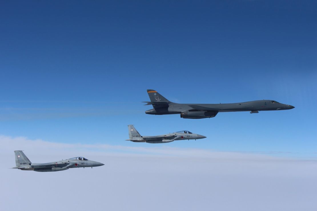 A US Air Force B-1B Lancer flies in formation with Japan Air Self Defense Force F-15s on March 21.