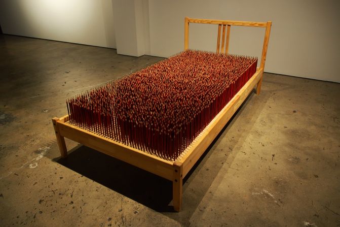 "Dream" is made from the bed Badiucao first slept on when he moved to Australia. It features 4,000 individually-sharpened pencils.