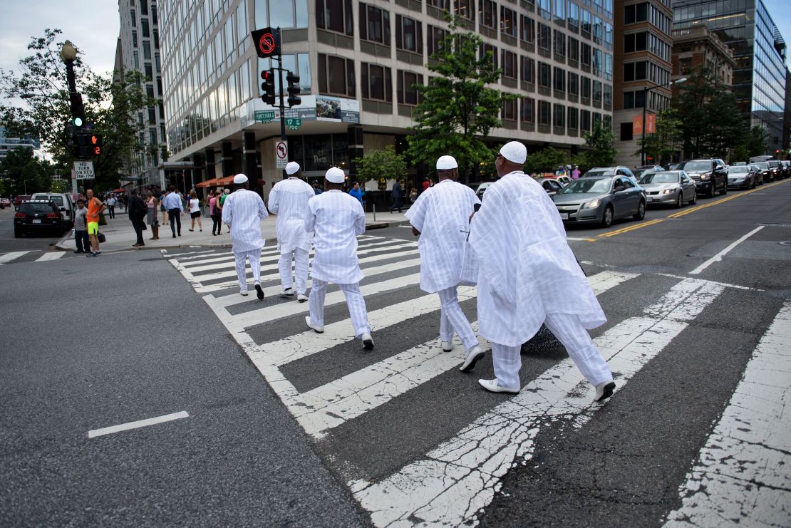 The Ooni of Ife is escorted across 17th Street near the White House June 22, 2016 in Washington, DC. His Majesty is keen to visit as many places as possible to "connect the dots" between Nigerian cultural heritage and the rest of the world.