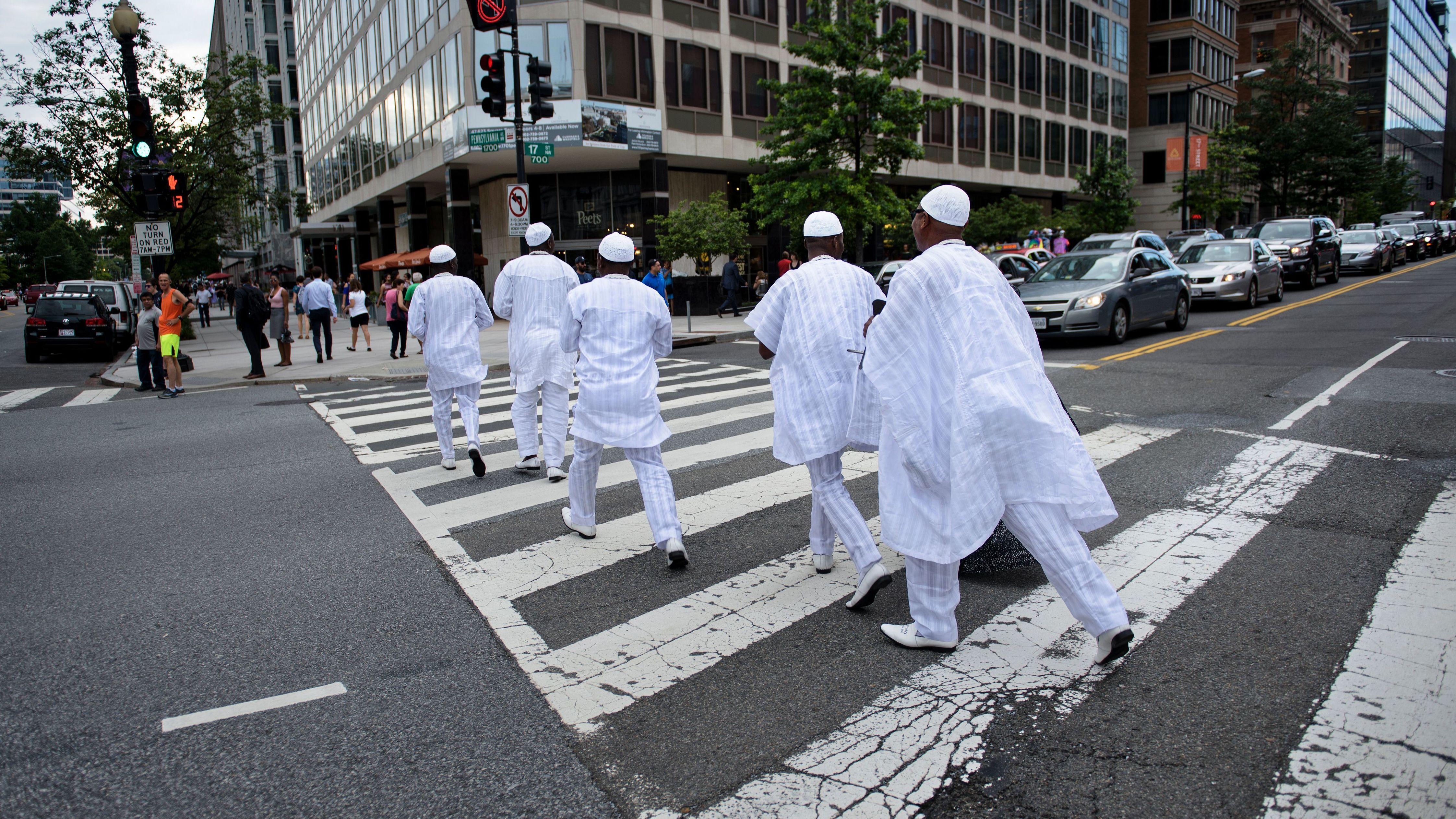 The Ooni of Ife is escorted across 17th Street near the White House June 22, 2016 in Washington, DC. His Majesty is keen to visit as many places as possible to "connect the dots" between Nigerian cultural heritage and the rest of the world. 