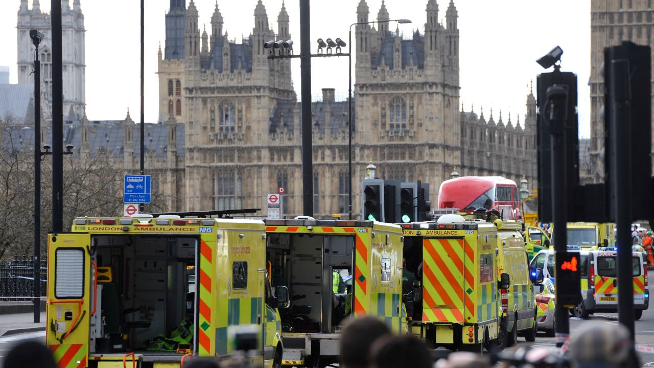 Ambulances wait as medics aid people on Westminster Bridge, near Parliament in central London, after an attack on March 22.