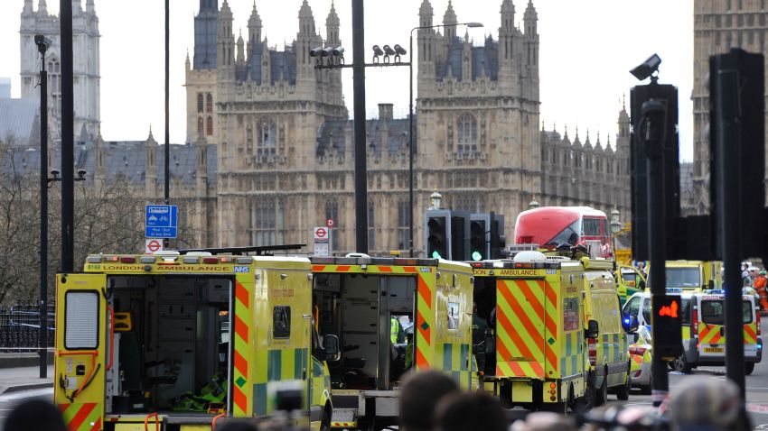 Ambulances wait as members of the emergency services work on Westminster Bridge, alongside the Houses of Parliament in central London on March 22, 2017, during an emergency incident.
British police shot a suspected attacker outside the Houses of Parliament in London on Wednesday after an officer was stabbed in what police said was a "terrorist" incident. One woman has died and others have "catastrophic" injuries following a suspected terror attack outside the British parliament, local media reported on Wednesday citing a junior doctor. / AFP PHOTO / NIKLAS HALLE'N        (Photo credit should read NIKLAS HALLE'N/AFP/Getty Images)