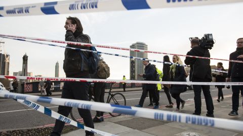 People cross Lambeth Bridge just before police cordon off access from the south side.