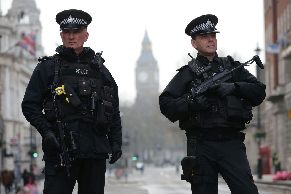 Armed police officers secure the area near the attack.