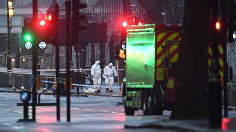 Forensic officers work at the scene of the attack.
