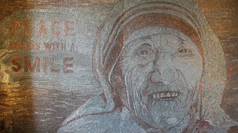 Artist Saimir Strati was inspired by the refugee crisis to create Mother Teresa's smiling portrait.