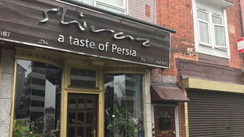 Police raided an apartment above this Persian restaurant.