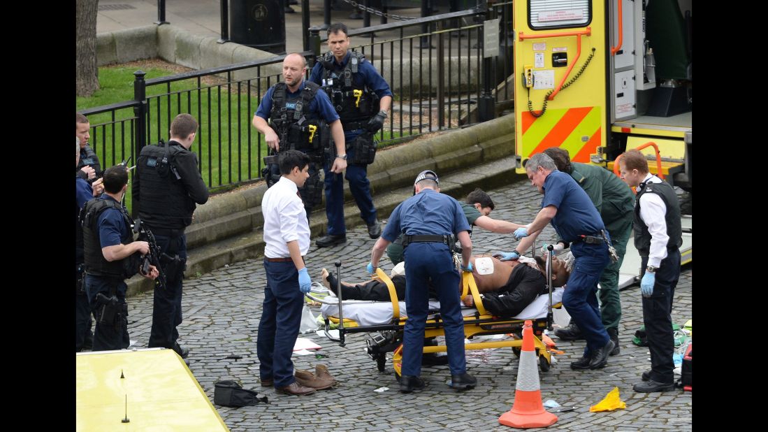 Masood is treated by emergency services as police look on at the scene outside the Houses of Parliament. The Metropolitan Police say he was born in Kent, but is believed to have been living in the West Midlands recently. Police say Masood was also known by a number of aliases. "Masood was not the subject of any current investigations and there was no prior intelligence about his intent to mount a terrorist attack," Met Police said in a statement.