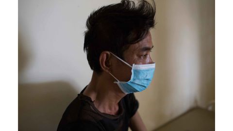 Ly Meng, 48, sits in his room on the drug-resistant TB ward at CENAT hospital in Phnom Penh. He is co-infected with HIV and drug-resistant TB. 