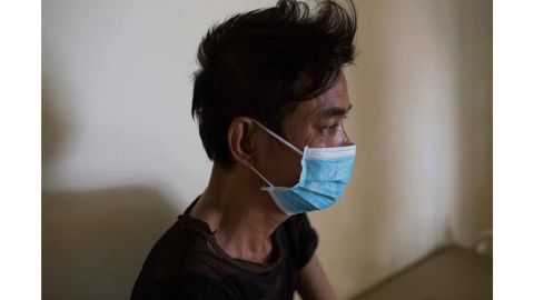 Ly Meng, 48, sits in his room on the drug-resistant TB ward at CENAT hospital in Phnom Penh. He is co-infected with HIV and drug-resistant TB.