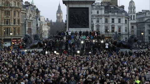 A somber crowd gathers in London's Trafalgar Square at the vigil for the victims of Wednesday's attack. 