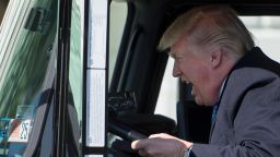US President Donald Trump sits in the drivers seat of a semi-truck as he welcomes truckers and CEOs to the White House in Washington, DC, March 23, 2017, to discuss healthcare. / AFP PHOTO / JIM WATSON        (Photo credit should read JIM WATSON/AFP/Getty Images)