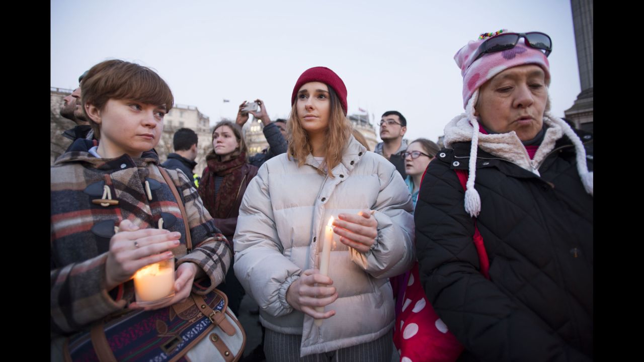 A crowd gathers in Trafalgar Square on Thursday, March 23, for a candlelit vigil to honor the victims of Wednesday's attack near Parliament in London. Emily Nye, a 21-year-old student at Goldsmiths, University of London, (center) says she was "devastated, but not surprised" to hear of the rampage.