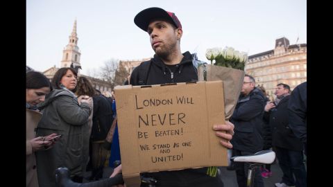 Patrick Johnson holds a sign that reads, "London will never be beaten! We stand as one and united!" Johnson says his mother was caught up in the 7/7 bombings in 2005, the coordinated attacks on London's transport system that left 52 dead and more than 700 injured. "This isn't going to defeat anyone," he said in a thick east London accent. "We're strong." "7/7, that didn't break us. This won't either."