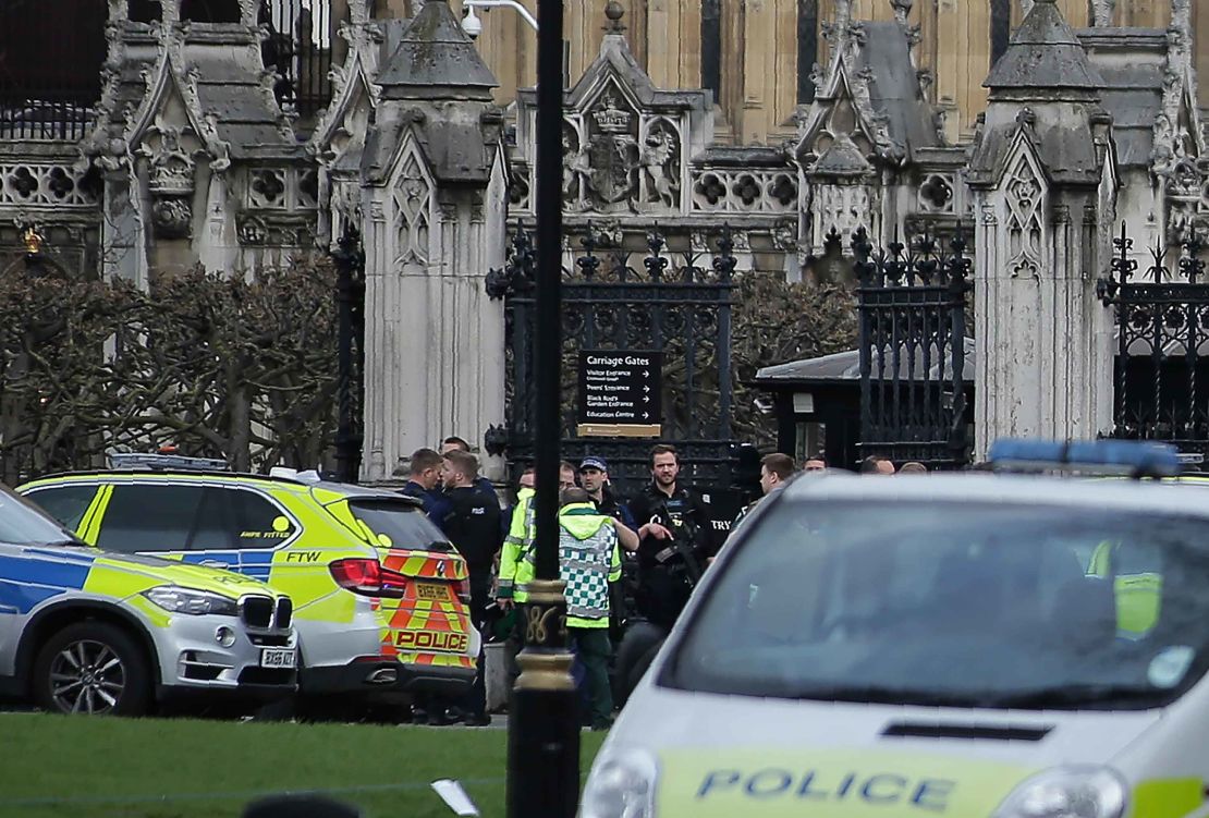 Paramedics arrive at Carriage Gates, where police officer Ketih Palmer was standing guard, after the Westminster attack.