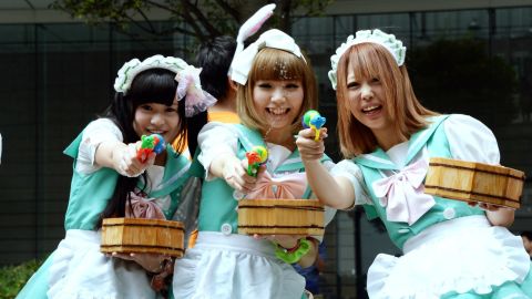 Cuteness is served: Maids shooting the breeze in Tokyo.
