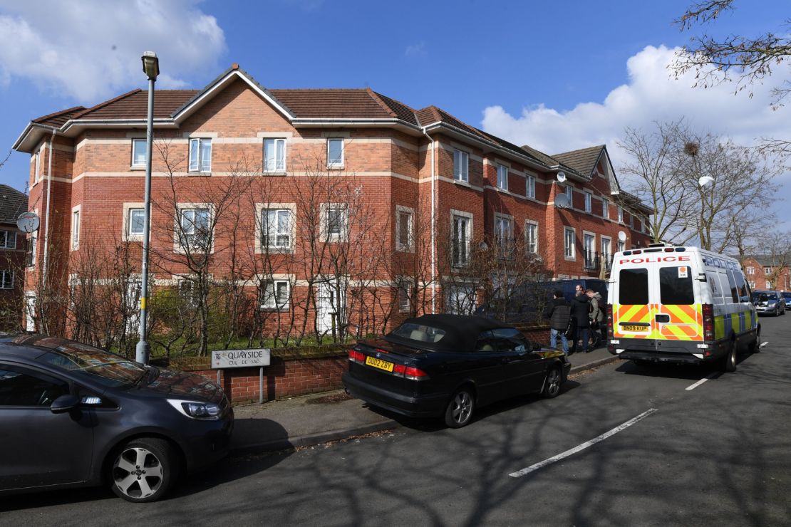 A police van is outside a residential building Thursday in Birmingham.