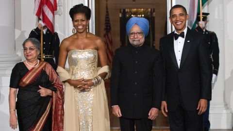 Michelle Obama wears a gown by Indian fashion designer Naeem Khan during a visit by Indian Prime Minister Manmohan Singh in 2009.