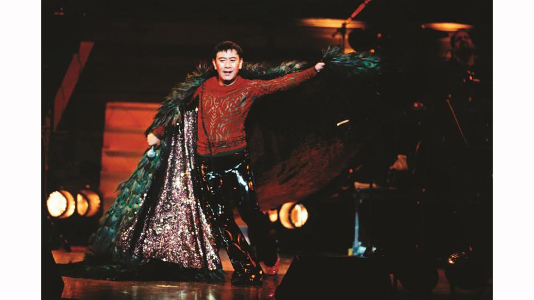 Canto-pop icon Roman Tam wears his costume with peacock feathers during his farewell concert in 1996.
