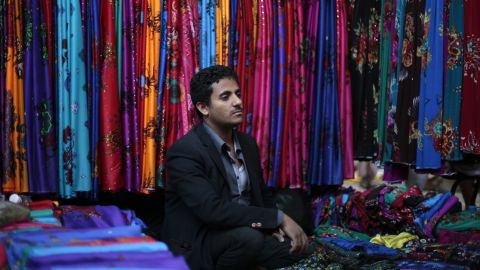 A Yemeni vendor waits for customers at a market in the old city of Sanaa.