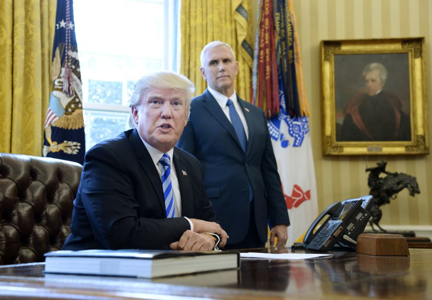 President Donald Trump speaks to members of the media as Vice President Mike Pence looks on in the Oval Office on Friday, March 27, after Republicans were forced to pull a health care bill that aimed to repeal and replace Obamacare. "We had no votes from the Democrats. They weren't going to give us a single vote, so it's a very very difficult thing to do," <a href="http://www.cnn.com/2017/03/24/politics/donald-trump-health-care-blame/index.html" target="_blank">Trump said</a>.