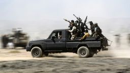 TOPSHOT - Armed Yemeni tribesmen loyal to the Shiite Huthi rebels sit in the back of an armed vehicle during a gathering to mobilise more fighters into several battlefronts on November 1, 2016 on the outskirts of the capital Sanaa. 
The war in Yemen escalated in March 2015 when the Saudi-led coalition launched a military campaign to push back the Huthi rebels, after they seized the capital in 2014 and then advanced on other parts of Yemen. 

 / AFP / MOHAMMED HUWAIS        (Photo credit should read MOHAMMED HUWAIS/AFP/Getty Images)