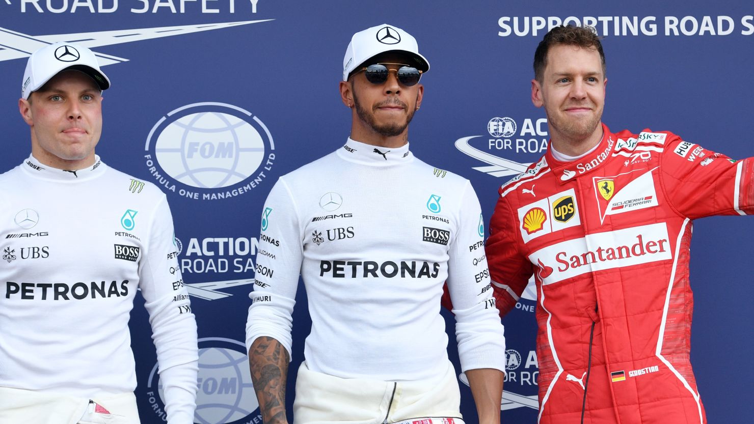 Lewis Hamilton claimed pole for Mercedes ahead of Ferrari's Sebastian Vettel (right) with teammate Valtteri Bottas third fastest.