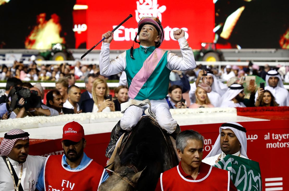 Jockey Mike Smith celebrates winning the 2017 Dubai World Cup at the Meydan Racecourse with Arrogate.