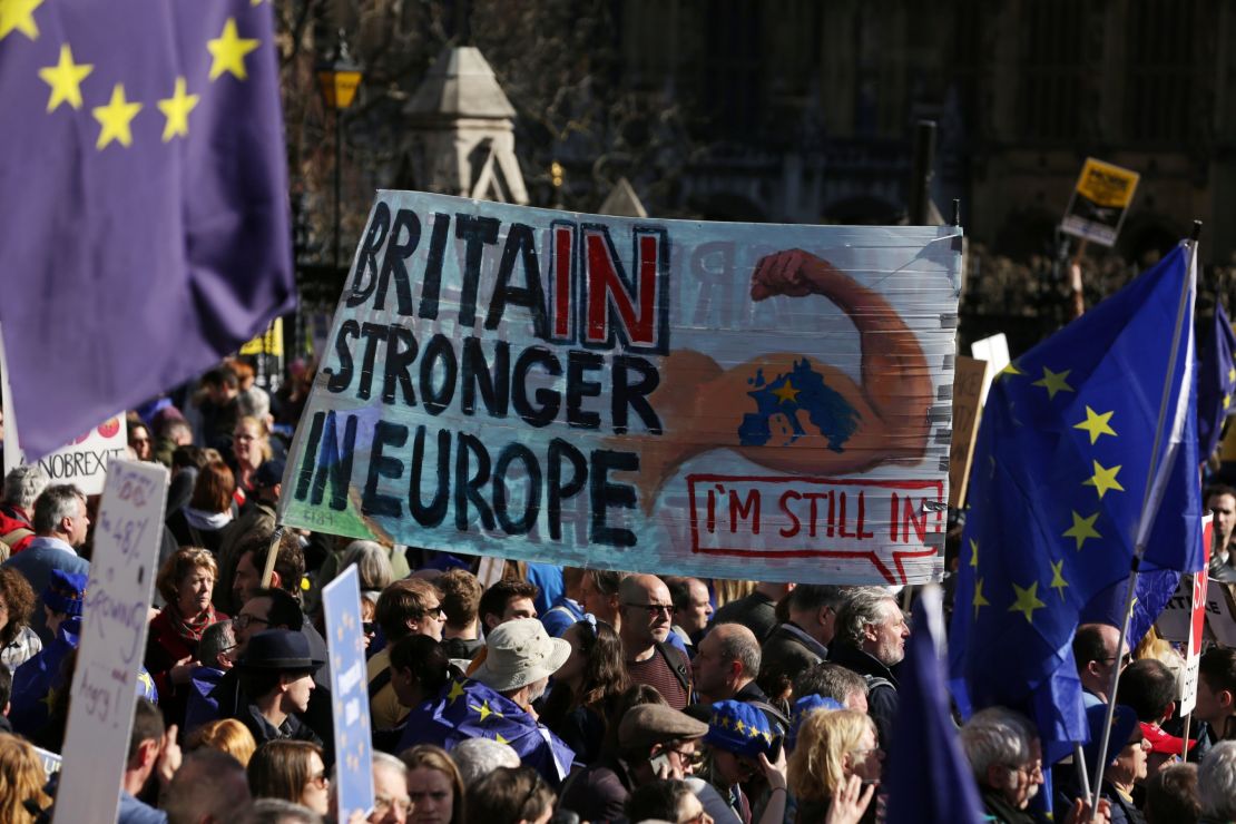 Demonstrators hold a placard that reads, "Britain stronger in Europe," during the march. 