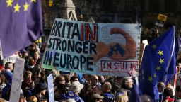 Demonstrators hold a placard during an anti Brexit, pro-European Union (EU) march in London on March 25, 2017, ahead of the British government's planned triggering of Article 50 next week.
Britain will launch the process of leaving the European Union on March 29, setting a historic and uncharted course to become the first country to withdraw from the bloc by March 2019. / AFP PHOTO / DANIEL LEAL-OLIVAS        (Photo credit should read DANIEL LEAL-OLIVAS/AFP/Getty Images)