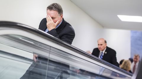US Rep. Chris Smith puts his hand to his face as he makes his way on Friday, March 24, to a meeting in Washington where House Speaker Paul Ryan announced <a href="http://www.cnn.com/2017/03/24/politics/house-health-care-vote/" target="_blank">the vote for the American Health Care Act had been canceled</a>.