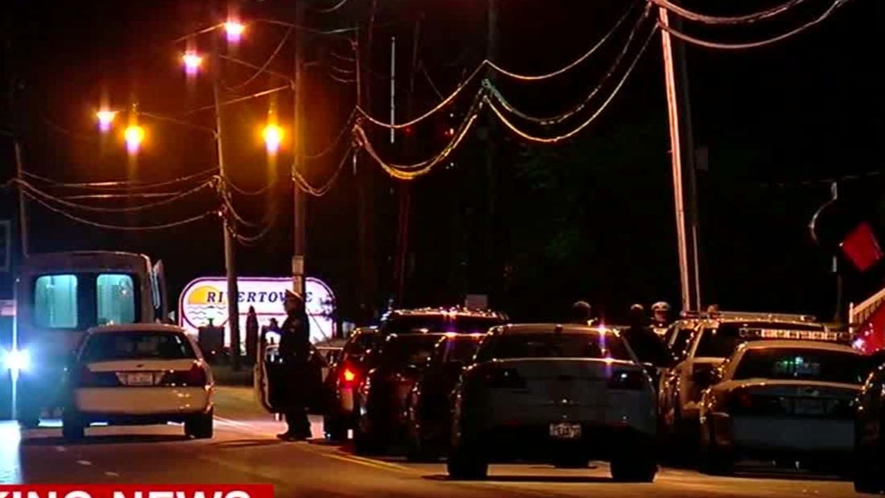 Police offficers investigate the crime scene at a Cincinnati nightclub.