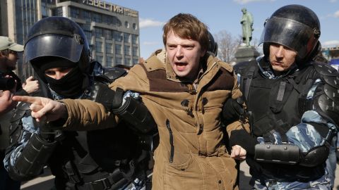Police detain a protester in  Moscow on Sunday.  