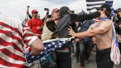 A scuffle breaks out between Pro-Trump and Anti-Trump protestors during Make America Great Again March on March 25, 2017 in Huntington Beach. According to reports, an anti-Trump protester doused an event organizer with pepper spray prompting Trump supporters to retaliate.